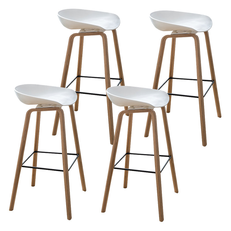 Modern Plastic Counter Stool Footrest Low Back Bucket Coffee Shop Bar Stool with Wood Legs White 4 Piece Set Clearhalo 'Bar Furniture' 'Bar Stools' 'bar_stools' 'furn' 'furn_bar_stools' 'furniture_bar_stools' 'Kitchen & Dining Furniture' 'kitchen&dining_furn' 'kitchen' 'kitchen_furn' Furniture' 4275817