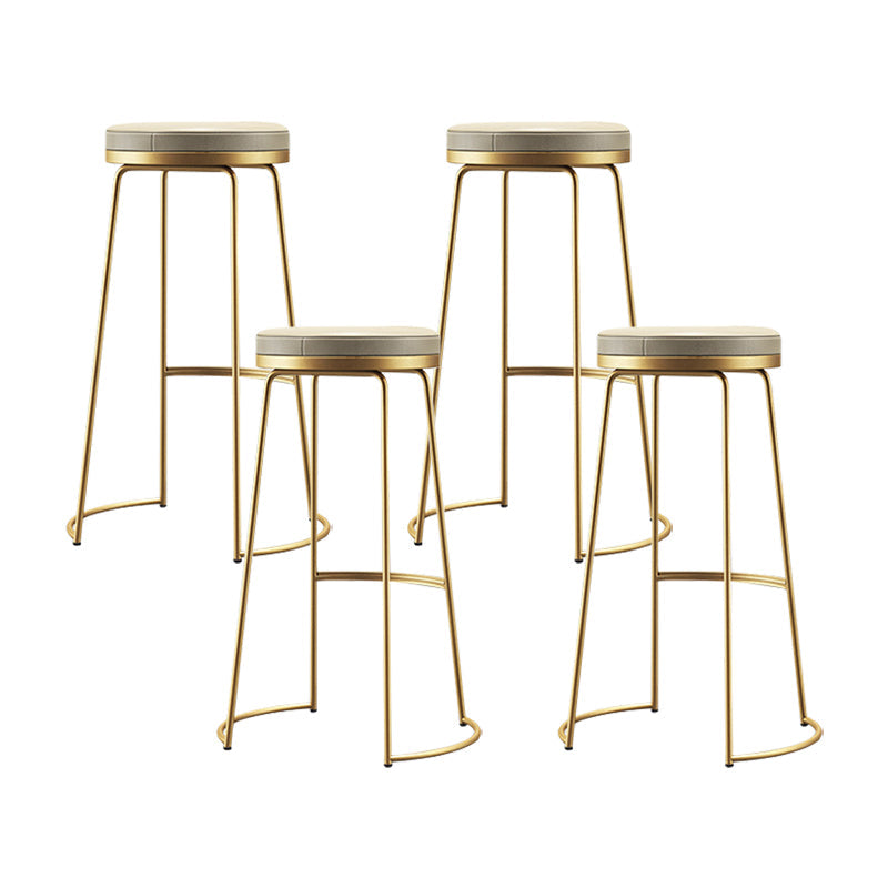 Modern Counter Round Bar Stool Armless Leather Backless Bar Stool with Footrest Gold 4 Piece Set Clearhalo 'Bar Furniture' 'Bar Stools' 'bar_stools' 'furn' 'furn_bar_stools' 'furniture_bar_stools' 'Kitchen & Dining Furniture' 'kitchen&dining_furn' 'kitchen' 'kitchen_furn' Furniture' 4297176