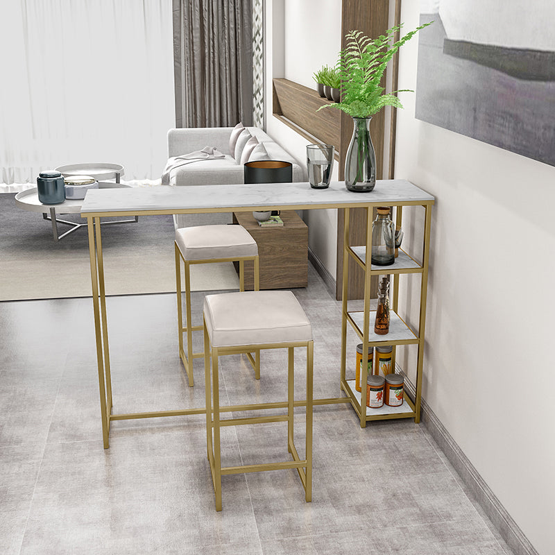 Glam Rectangle Indoor Bar Dining Table Iron Trestle Pedestal Bistro Table with Shelve 55.1"L x 15.7"W x 41.3"H Gold Clearhalo 'Bar Furniture' 'Bar Tables' 'bar_tables' 'furn' 'furn_bar_tables' 'Furniture' 'furniture_bar_tables' 'Kitchen & Dining Furniture' 'kitchen&dining_furn' 'kitchen' 4335372