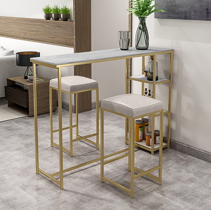 Glam Rectangle Indoor Bar Dining Table Iron Trestle Pedestal Bistro Table with Shelve 47.2"L x 15.7"W x 41.3"H Gold Clearhalo 'Bar Furniture' 'Bar Tables' 'bar_tables' 'furn' 'furn_bar_tables' 'Furniture' 'furniture_bar_tables' 'Kitchen & Dining Furniture' 'kitchen&dining_furn' 'kitchen' 4335381