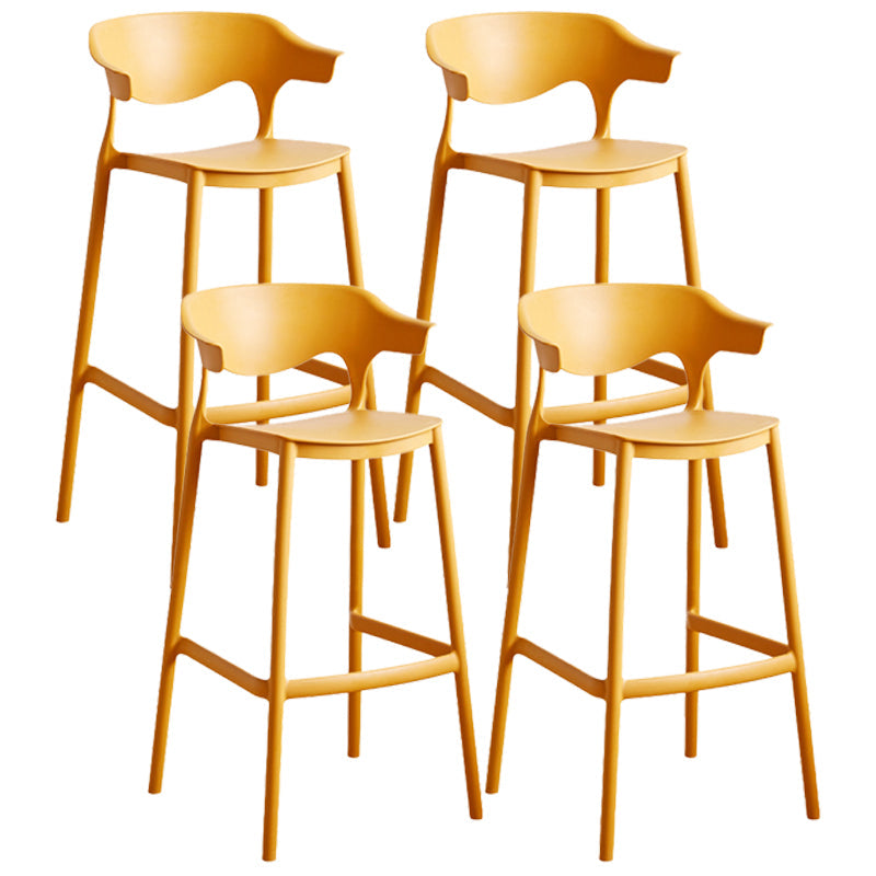 Stackable Plastic Indoor Counter Stools Low Back Scandinavian Bar Stools with Footrest Yellow 4 Piece Set Bar Stool(30"H) Clearhalo 'Bar Furniture' 'Bar Stools' 'bar_stools' 'furn' 'furn_bar_stools' 'furniture_bar_stools' 'Kitchen & Dining Furniture' 'kitchen&dining_furn' 'kitchen' 'kitchen_furn' Furniture' 4339801