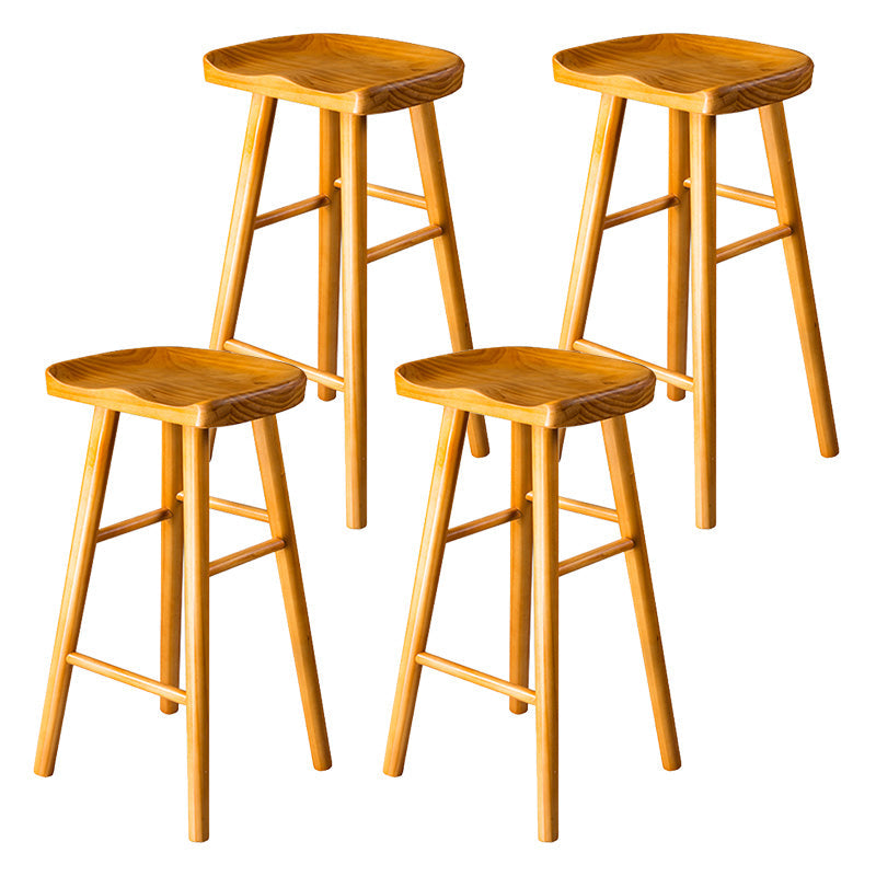 Modern Saddle Seat Bar Stool Pine Backless Footrest Counter Stool with Wood Legs Light Wood 4 Piece Set Counter Stool(26"H) Clearhalo 'Bar Furniture' 'Bar Stools' 'bar_stools' 'furn' 'furn_bar_stools' 'furniture_bar_stools' 'Kitchen & Dining Furniture' 'kitchen&dining_furn' 'kitchen' 'kitchen_furn' Furniture' 4344518