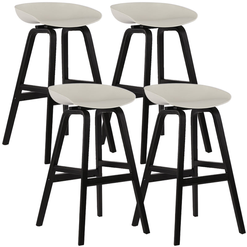 Wood Plastic Counter Stools Backless Scandinavian Bar Stools with Bucket Seat Black White 4 Piece Set Clearhalo 'Bar Furniture' 'Bar Stools' 'bar_stools' 'furn' 'furn_bar_stools' 'furniture_bar_stools' 'Kitchen & Dining Furniture' 'kitchen&dining_furn' 'kitchen' 'kitchen_furn' Furniture' 4392839