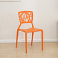 Contemporary Open Back Chair Plastic Stackable Dining Armless Side Chair Orange 1 Piece Clearhalo ' kitchen&dining_furn' 'Dining Chairs' 'Dining Tables & Seating' 'dining_chair' 'furn' 'furn_dining_chair' 'Furniture' 'furniture_dining_chair' 'Kitchen & Dining Furniture' 'kitchen' 4577215