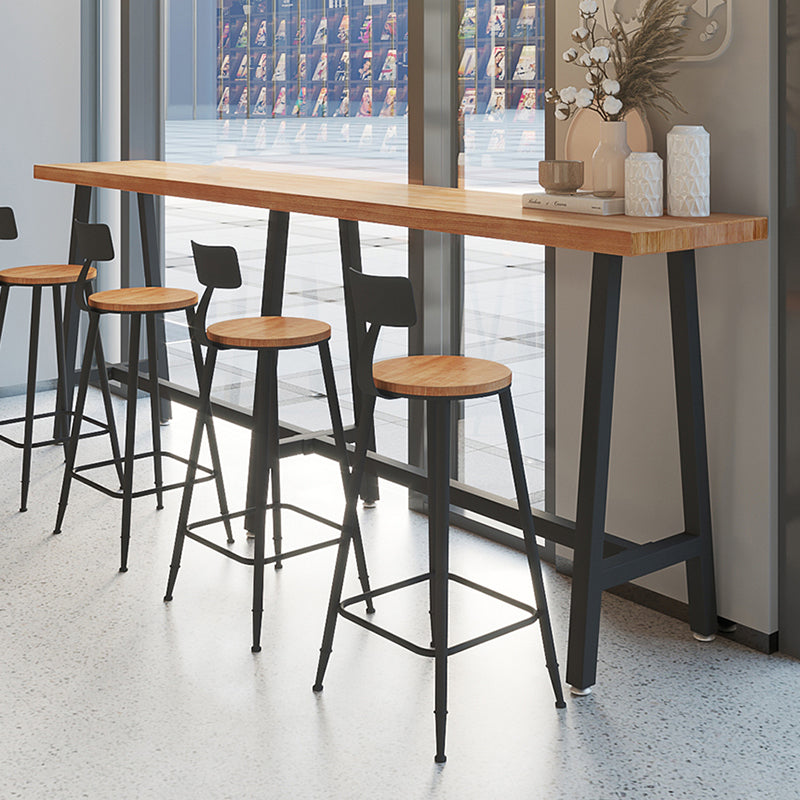 Brown Modern Style Bar Table Solid Wood and Black Iron Foot Coffee Shop Bar Table 126"L x 15.7"W x 41.3"H Without Chairs Clearhalo 'Bar Furniture' 'Bar Tables' 'bar_tables' 'furn' 'furn_bar_tables' 'Furniture' 'furniture_bar_tables' 'Kitchen & Dining Furniture' 'kitchen&dining_furn' 'kitchen' 4638758