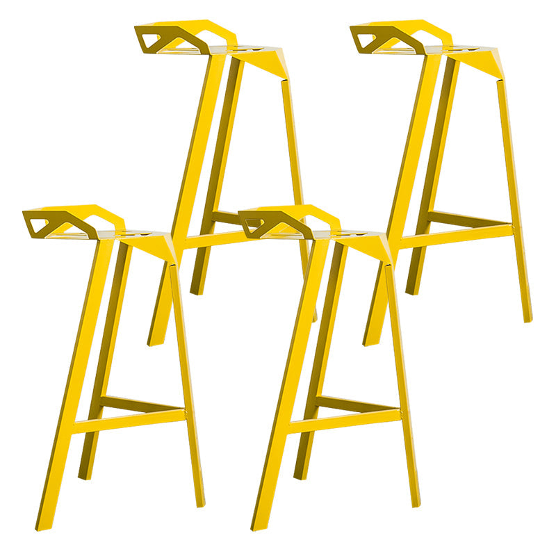 Industrial Stackable Iron Counter Stools Low Back 3 Legs Bar Stools with Footrest Yellow 4 Piece Set Clearhalo 'Bar Furniture' 'Bar Stools' 'bar_stools' 'furn' 'furn_bar_stools' 'Furniture' 'furniture_bar_stools' 'Kitchen & Dining Furniture' 4730372