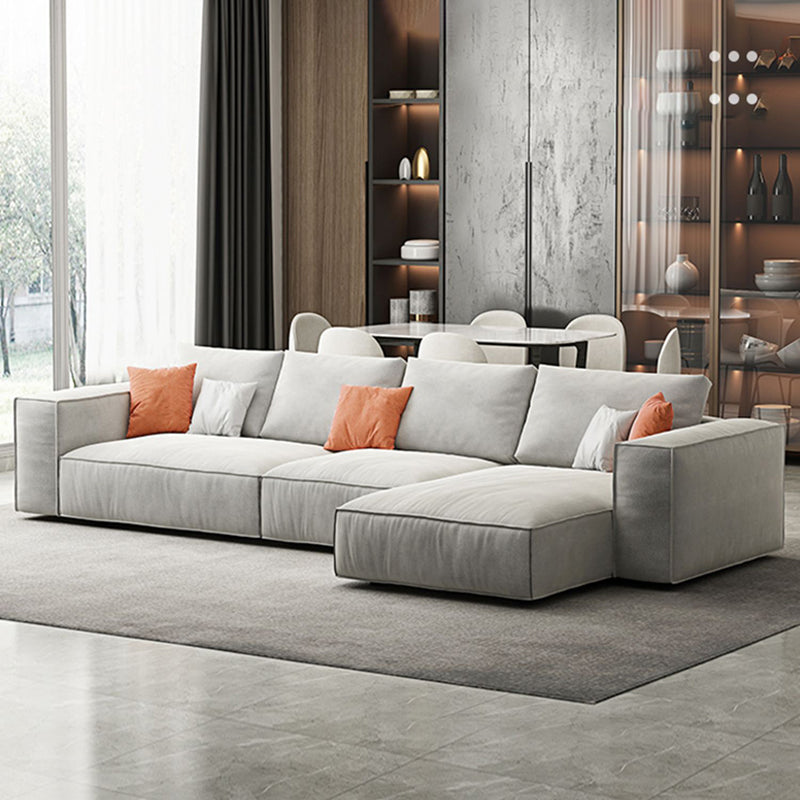 Simple Light-grey Sofa/Sectional with Faux Leather and Pillowed Back Cushions 138"L x 51"W x 26"H Clearhalo 'furn' 'furn_sectionals' 'Furniture' 'furniture_sectionals' 'kitchen' 'kitchen_sectionals' 'Living Room Furniture' 'Sectionals' 4785367
