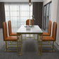 Esstisch im Glam-Stil mit Steinplatte und goldenem Sockel für das Wohnzimmer