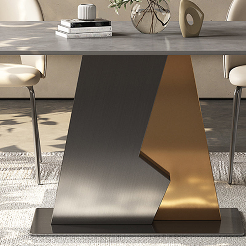 Table à manger en pierre industrielle industrielle dans une table à manger rectangulaire gris avec base de piédestal