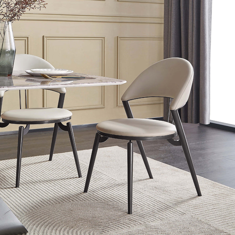 Minimalistische stijl armloze open achterkant stoelen faux lederen eetkamerstoelen