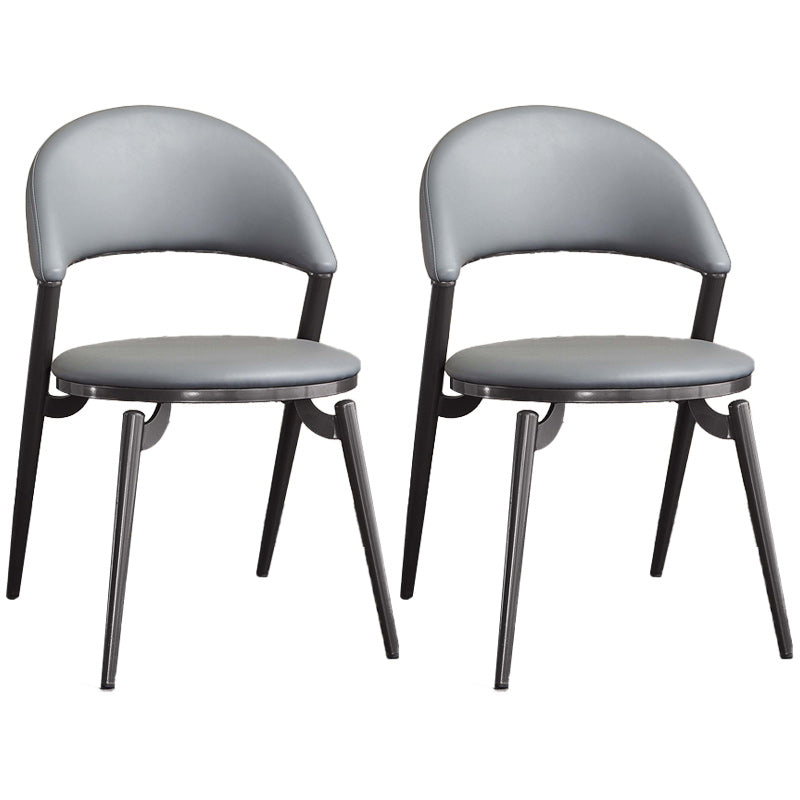 Minimalistische stijl armloze open achterkant stoelen faux lederen eetkamerstoelen