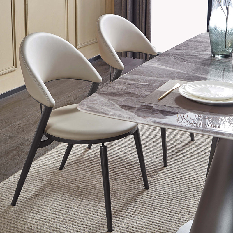 Minimalistische stijl armloze open achterkant stoelen faux lederen eetkamerstoelen