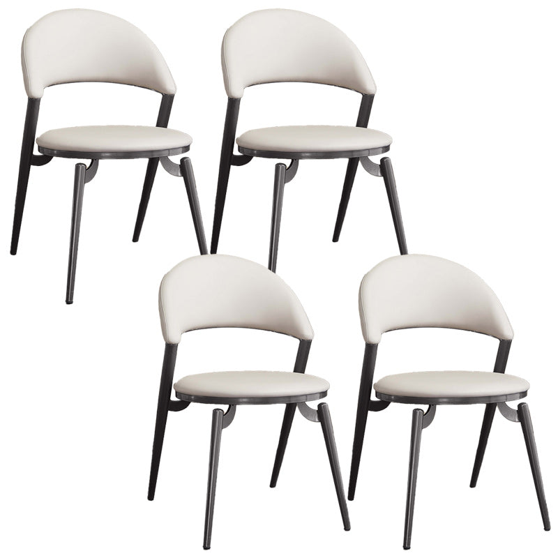 Minimalistische stijl armloze open achterkant stoelen faux lederen eetkamerstoelen