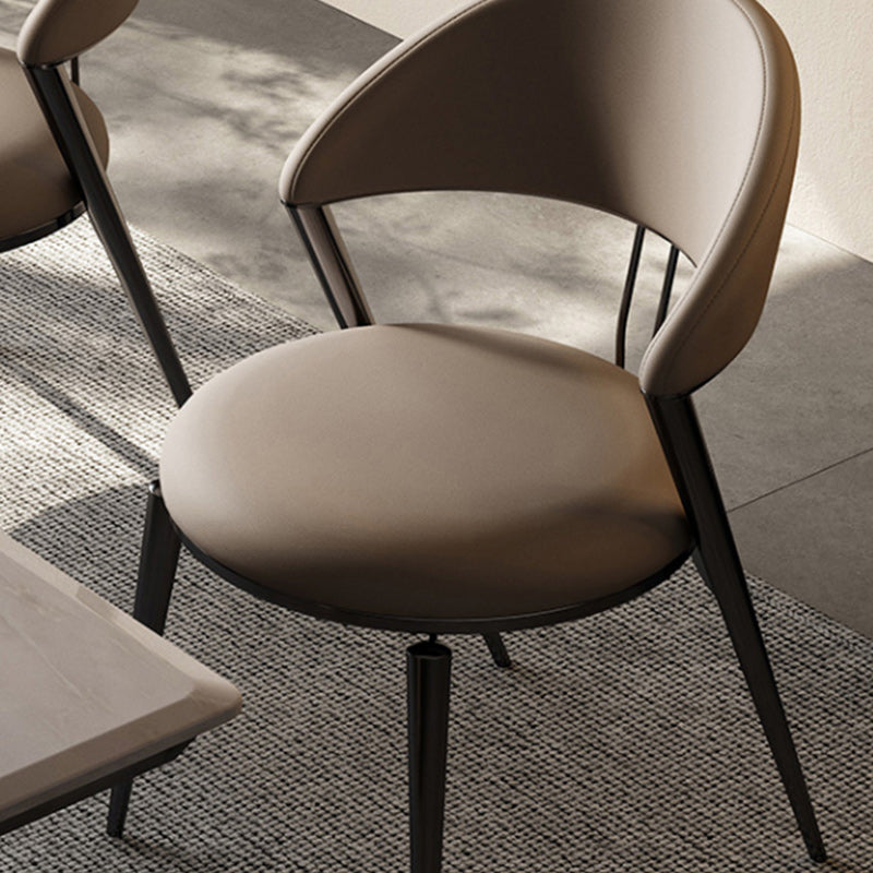 Minimalistische stijl armloze open achterkant stoelen faux lederen eetkamerstoelen