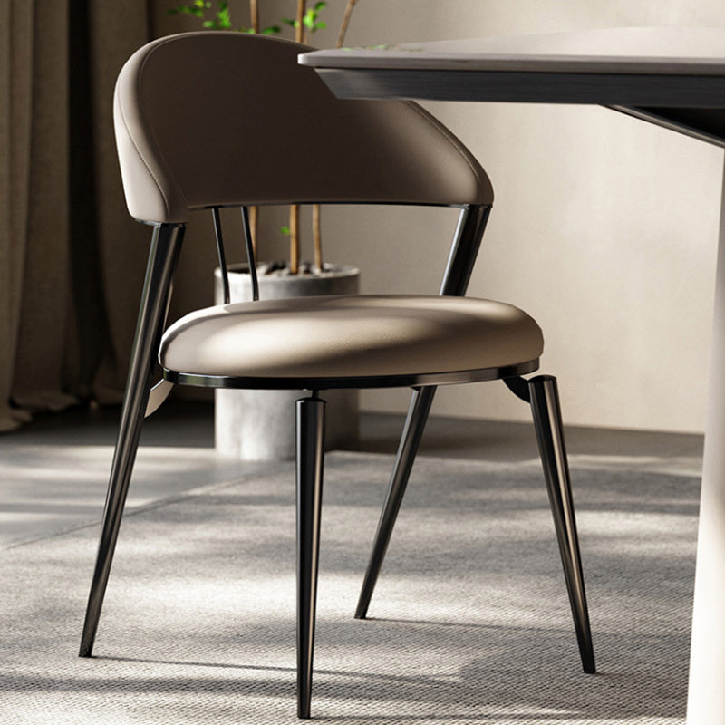 Minimalistische stijl armloze open achterkant stoelen faux lederen eetkamerstoelen