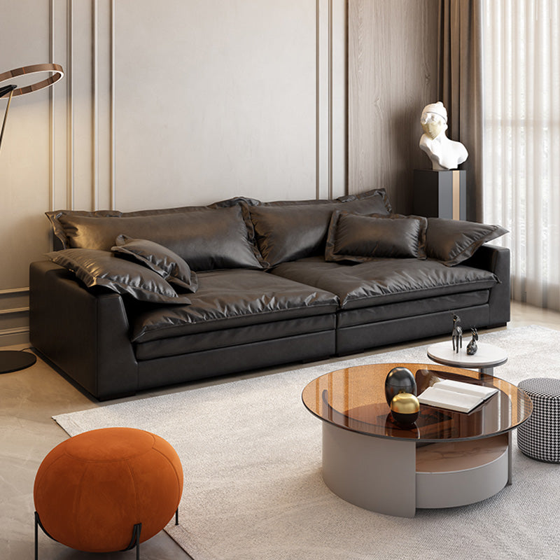 Soggiorno in vetro in pelle stazionaria in vetrino. Divano nero