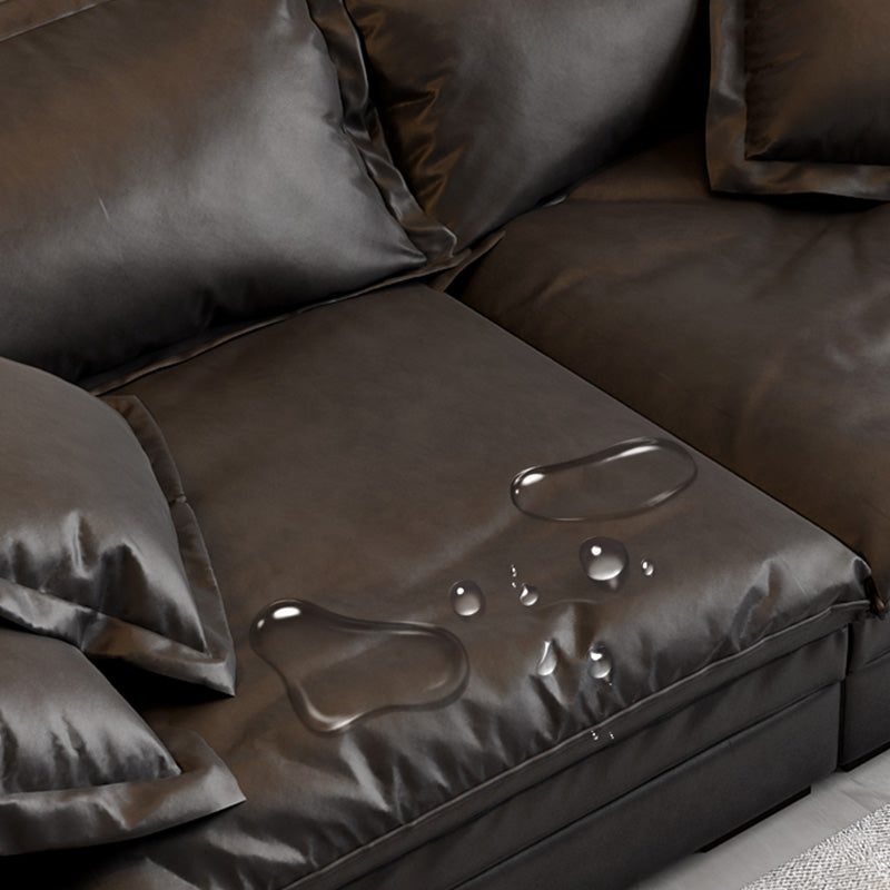 Soggiorno in vetro in pelle stazionaria in vetrino. Divano nero