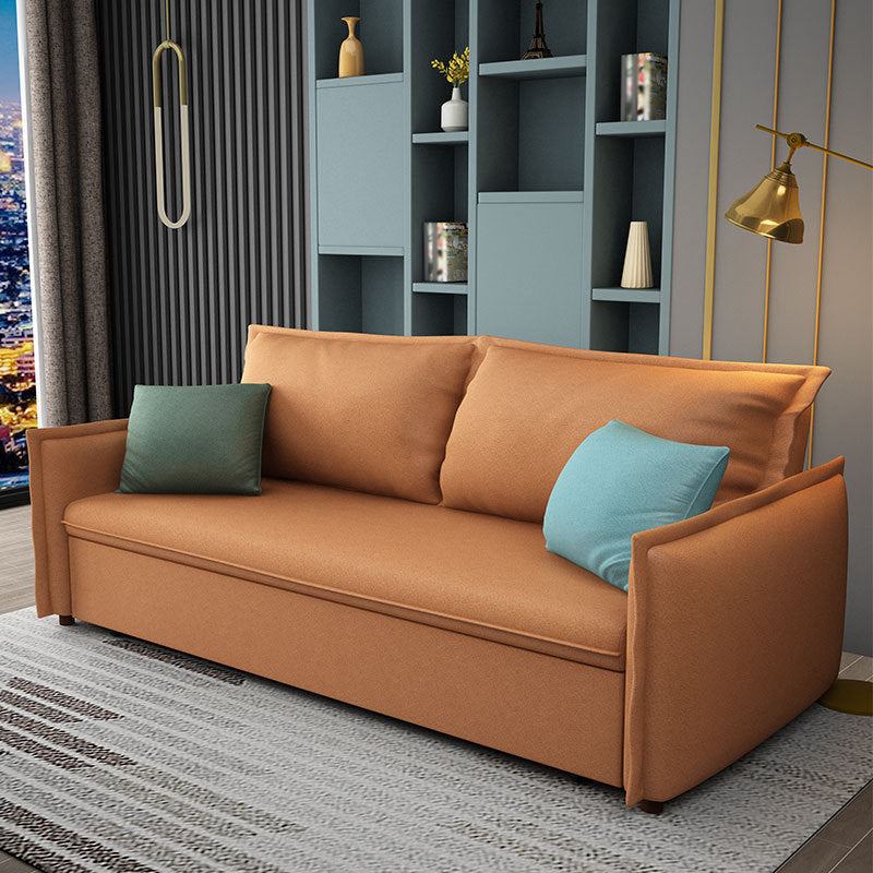 Canapé-lit orange en s'amuser avec 2 oreillers en arrière et bras carré