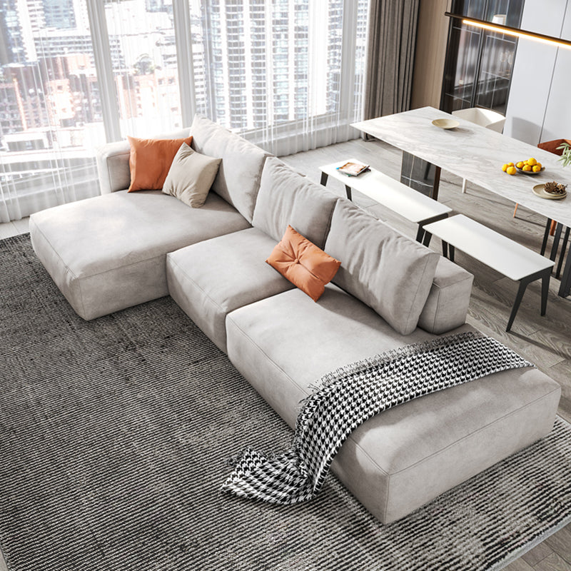 Sofá de brazo cuadrado de cuero falso con chaise moderno sofá de espalda suelta en gris