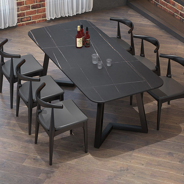Mesa de comedor rectangular industrial de piedra sinterizada negra con base de metal