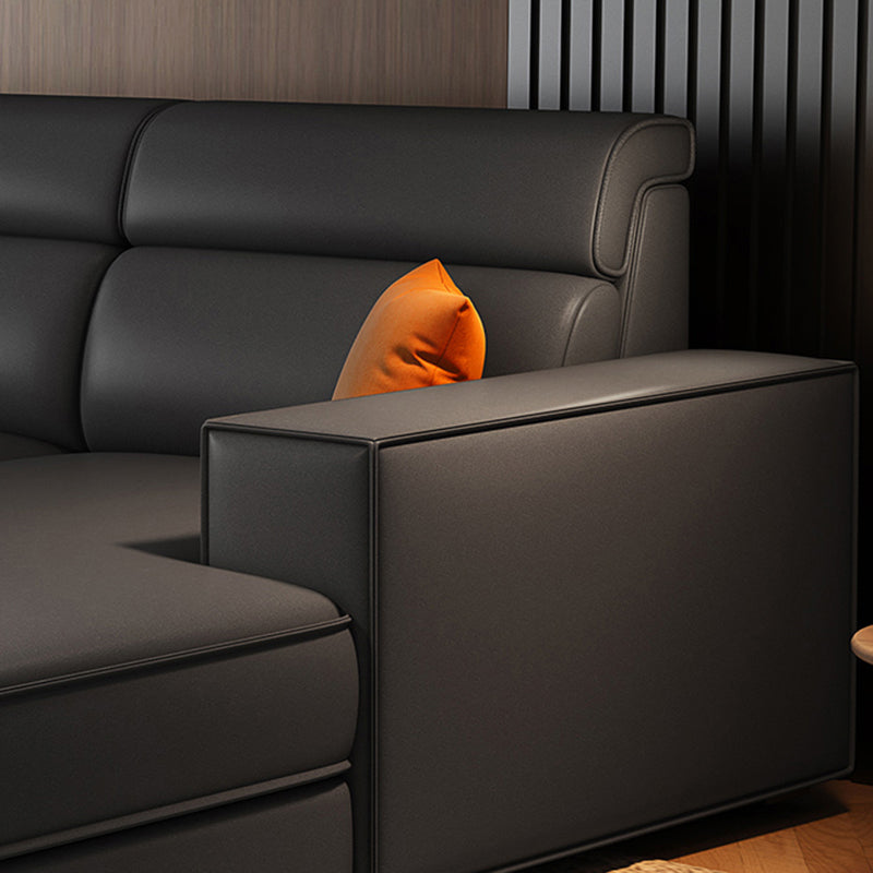 Divano in finta pelle scandinavo grigio scuro del braccio quadrato.