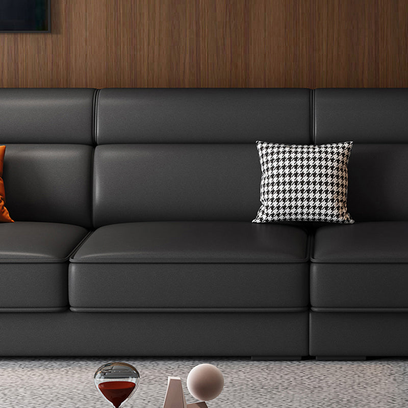 Divano in finta pelle scandinavo grigio scuro del braccio quadrato.