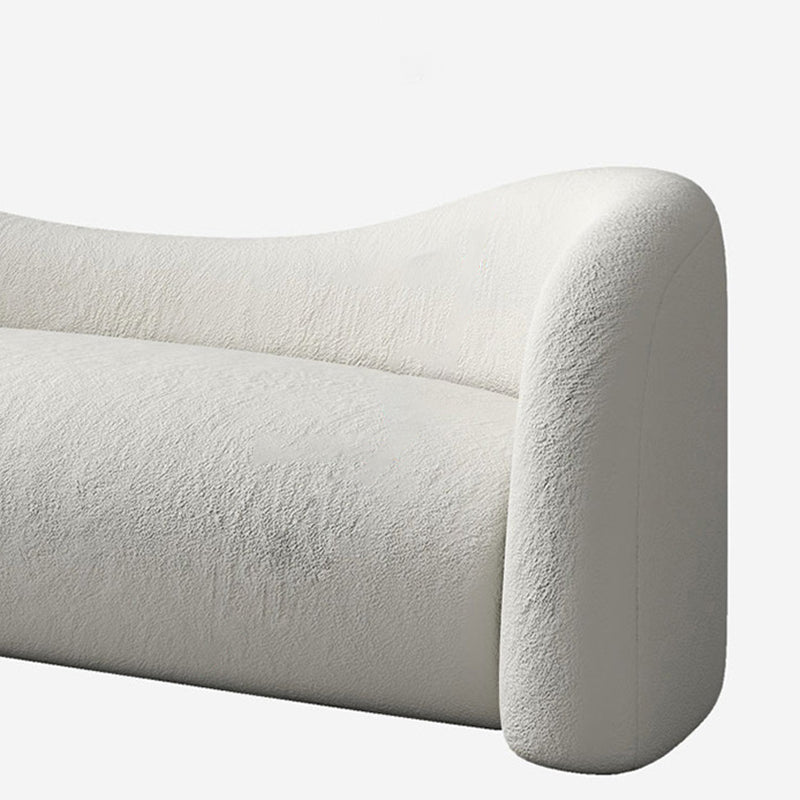 リビングルームのためにタイトな背中を持つ現代の湾曲したソファの傾斜腕ソファ