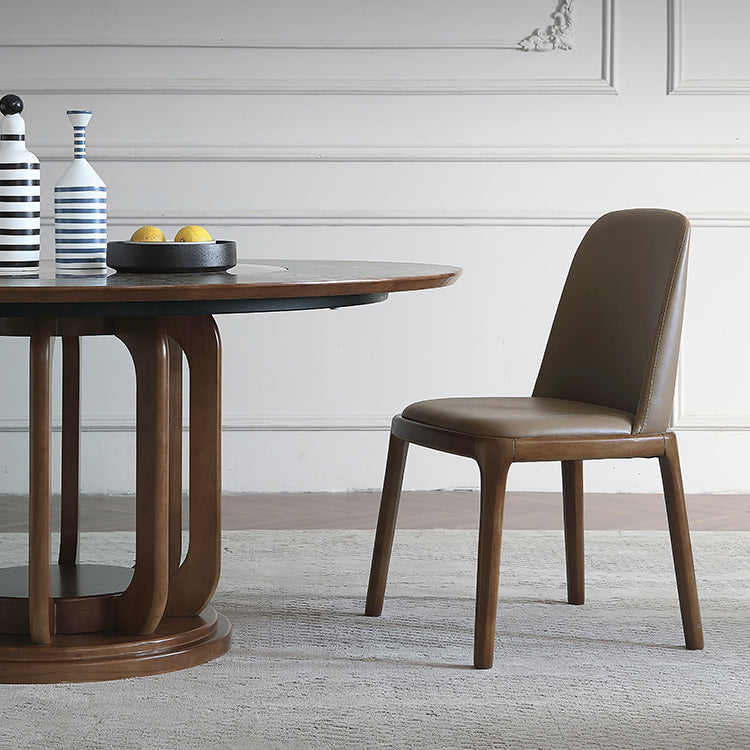 Eigentijdse ronde eettafel bruine as houten voetstuktafel