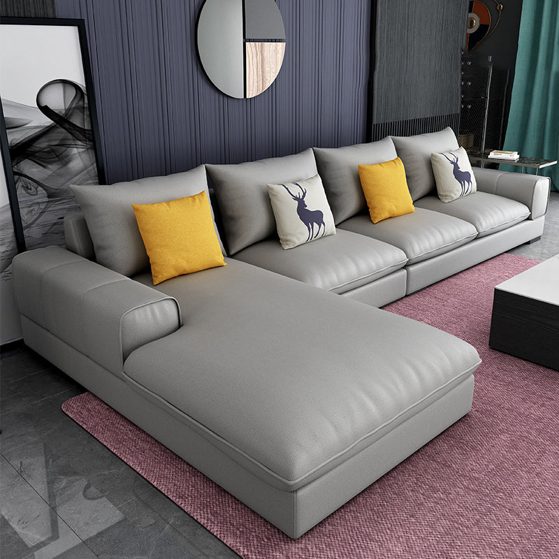 Section contemporaine en L avec oreiller en dos et bras encastrés pour 4 personnes