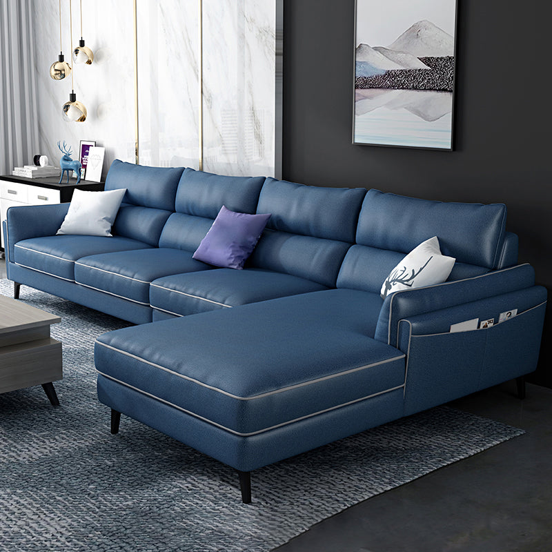 Sectionnel en faux cuir en L avec bras encastrés et rangement