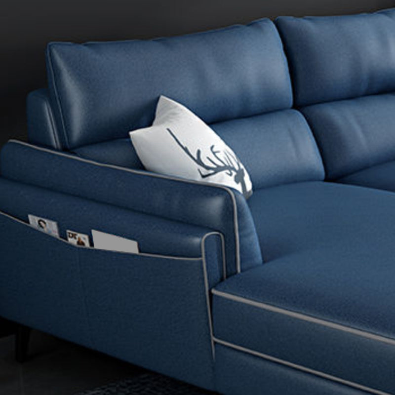 Sectionnel en faux cuir en L avec bras encastrés et rangement