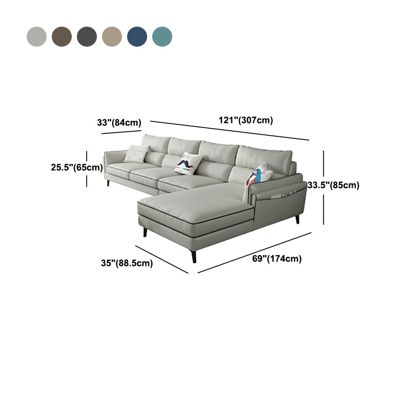 Sectionnel en faux cuir en L avec bras encastrés et rangement
