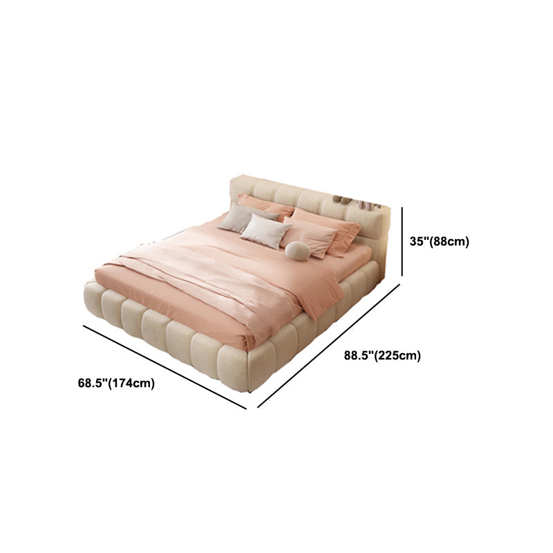 Cama de estilo moderno con cama de cabecera tapizada con mechones