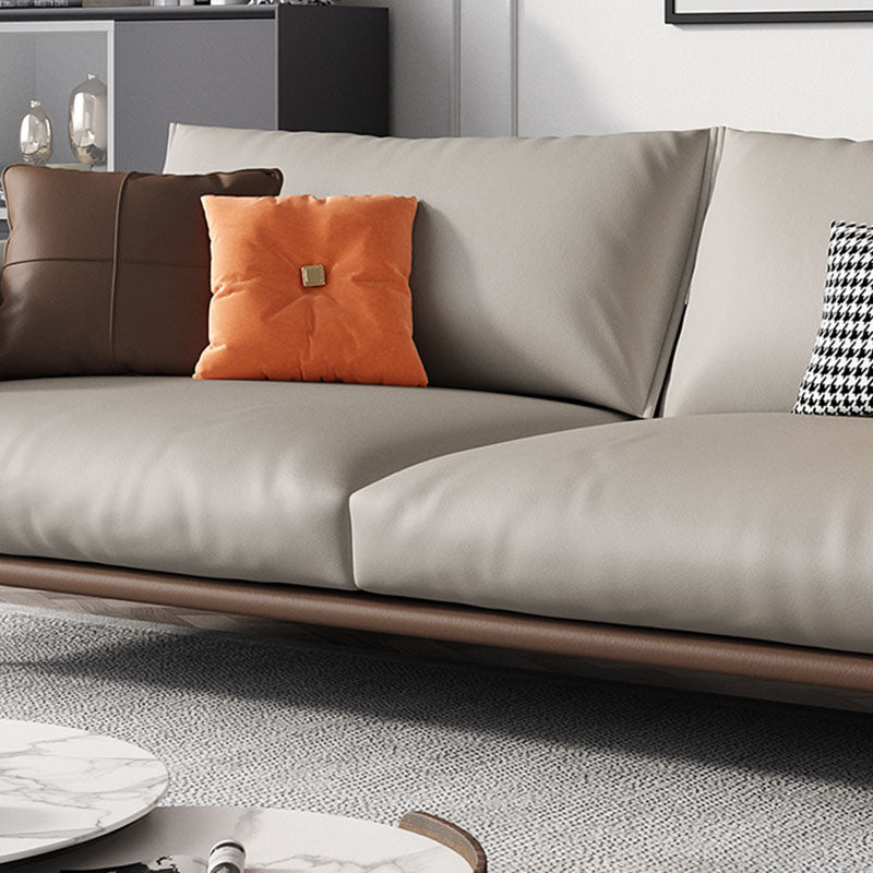 Sofá de cuero moderno de brazo de almohada en marrón con patas de metal