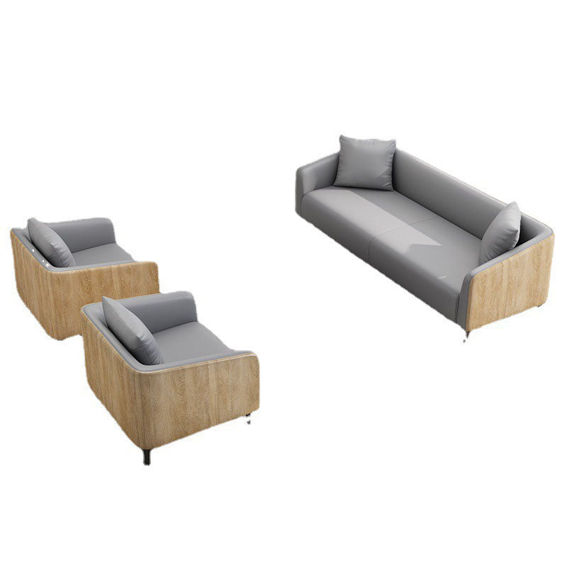 モダニズムフェイクレザーソファタキシードアームソファと木目アクセント