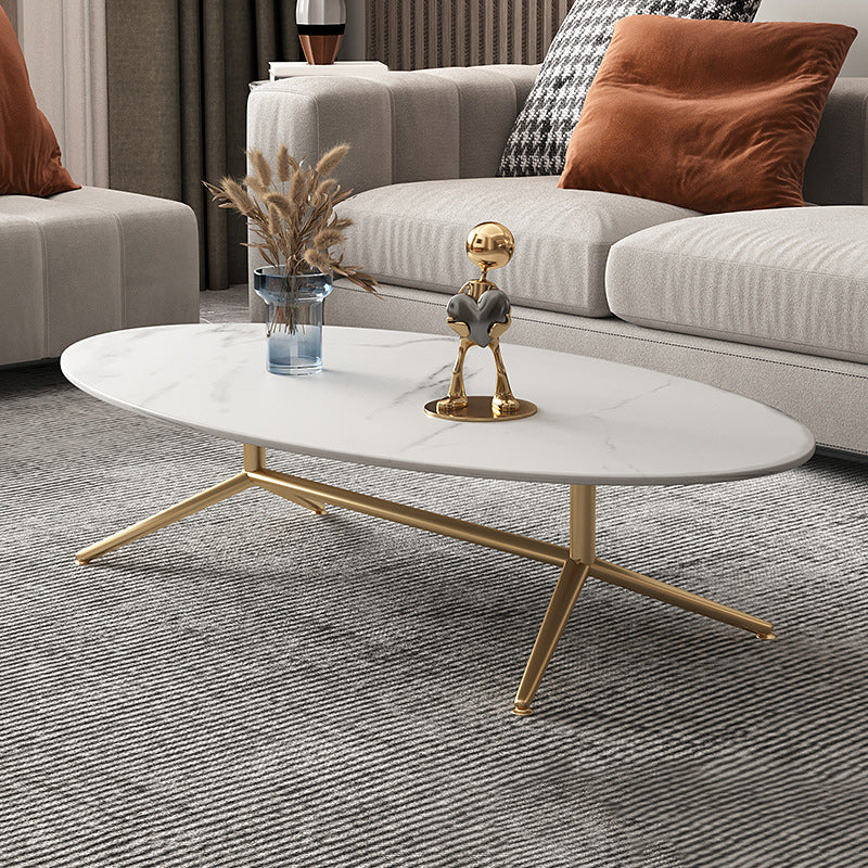 Mesa de centro estilo Glam con tapa de piedra ovalada y base de caballete de acero