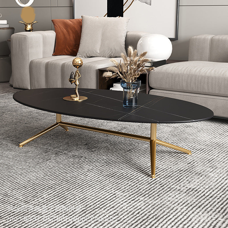 Mesa de centro estilo Glam con tapa de piedra ovalada y base de caballete de acero