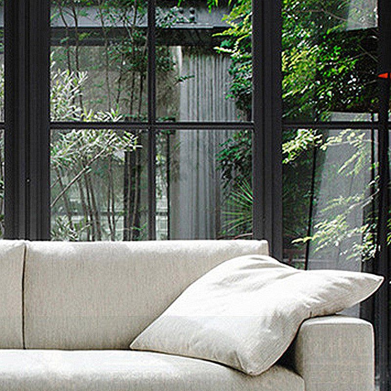 Divano a braccio quadrato moderno con cuscini in bianco per soggiorno