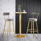 Taburete de bar de metal Glam con respaldo de tela y base dorada