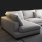 Sectionele zitbank met stoffen kussen en vierkante arm in grijs