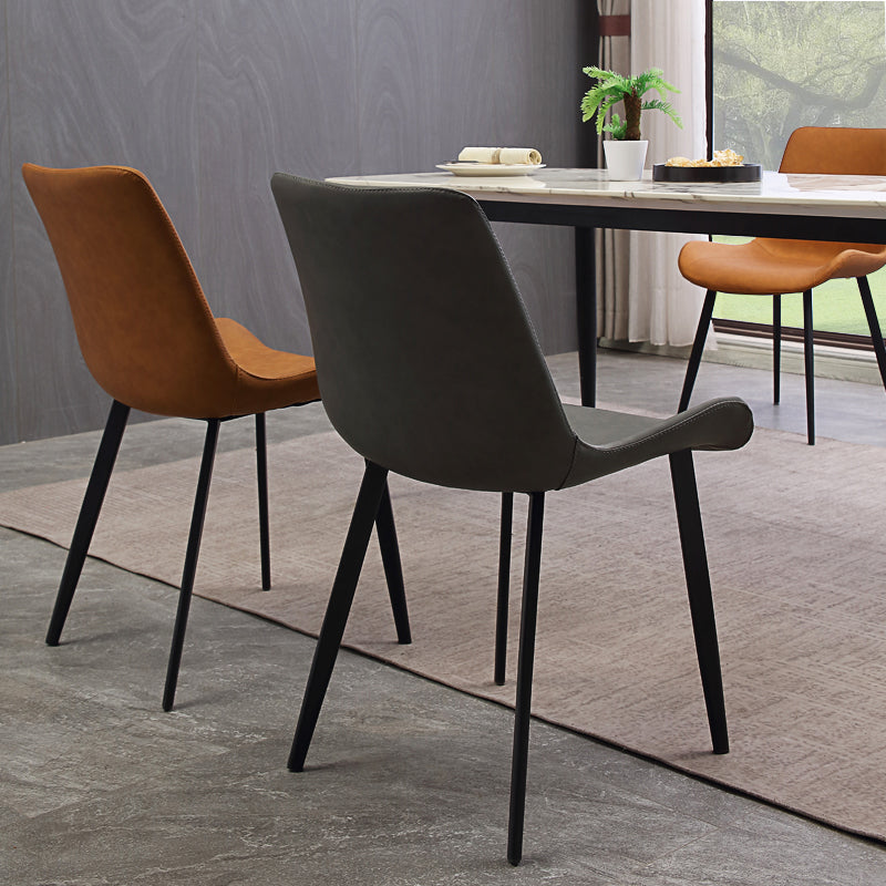 Gestoffeerde armloze eetkamerstoelen faux leer en metalen eetstoelen