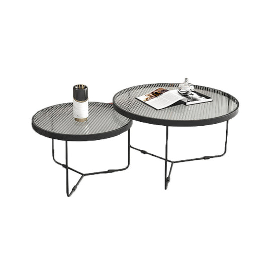 Tavolino contemporaneo di caffettiera con nidificazione rotonda con top in vetro e base di ferro