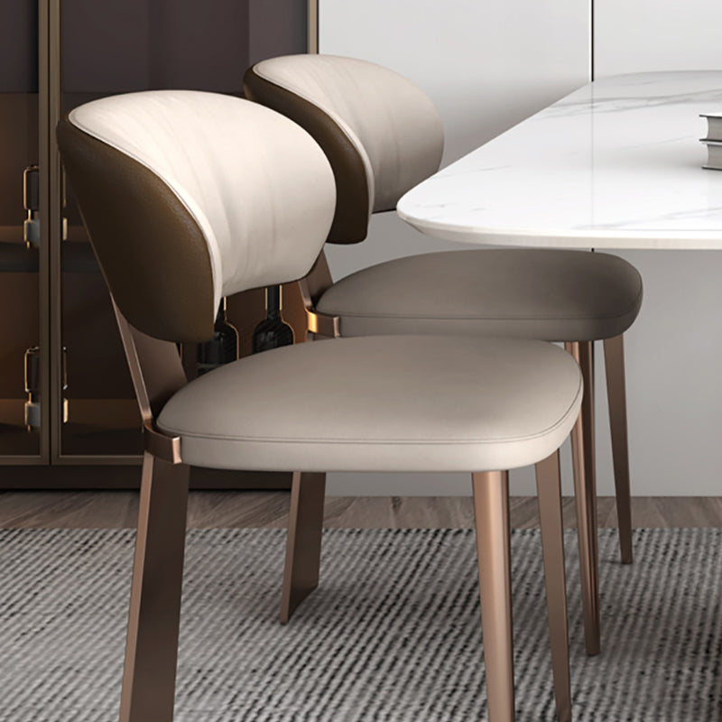 Glam -eetkamerstoel faux leer en metalen armloze eetkamerstoelen