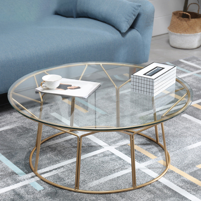 Tavolino contemporaneo con top in vetro rotondo e base di ferro