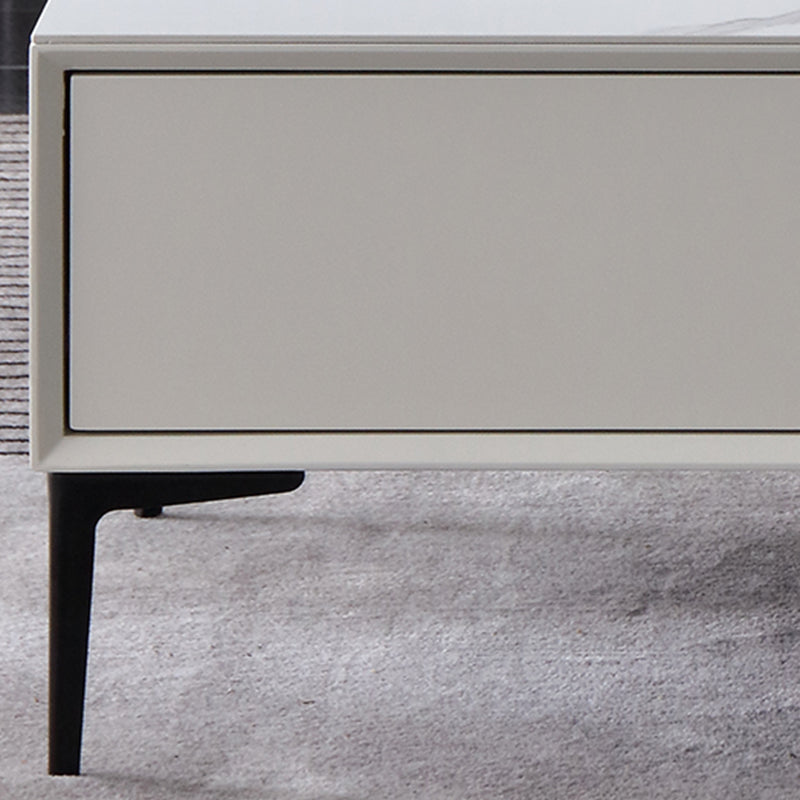 Tavolino bianco rettangolare con 4 cassetti e 4 gambe metalliche