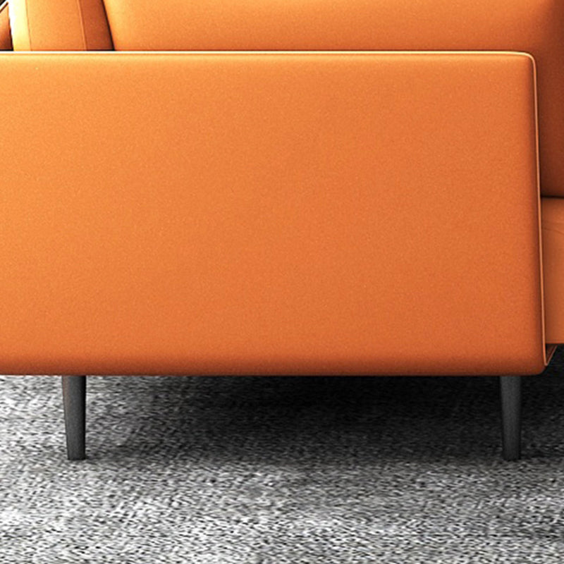 Divano con divano arancione in finta pelle cuscino con gambe metalliche