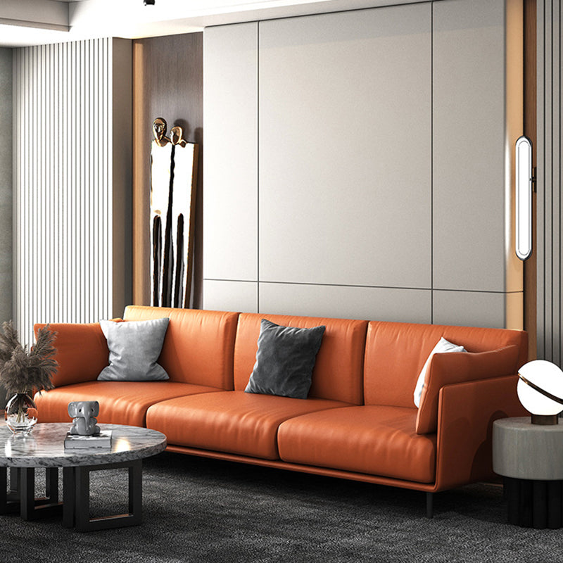 Divano con divano arancione in finta pelle cuscino con gambe metalliche