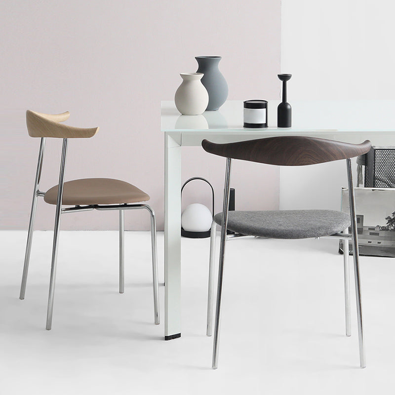 Moderne stijl gestoffeerde armloze stoel lederen eetkamerstoel met metalen basis