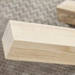 Table basse scandinave avec pieds croisés en bois massif naturel