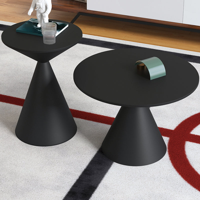 Moderne zwart/witte salontafel met ronde bovenkant, ijzeren voetstuk, cocktailtafel uit het midden van de eeuw